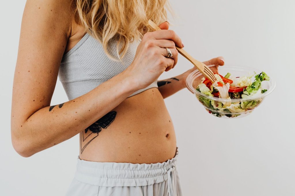 Healthy pregnancy foods including vegetables, fruit, eggs and nutritious protein sources