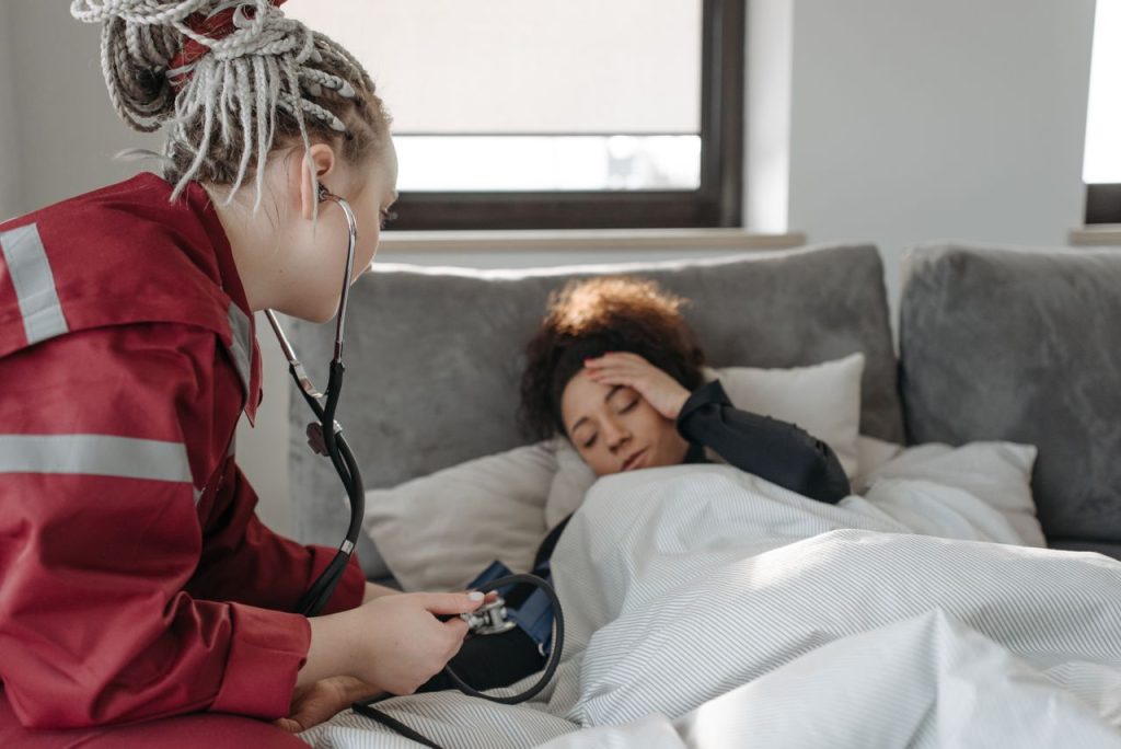 Healthcare professional examining a woman during pregnancy care