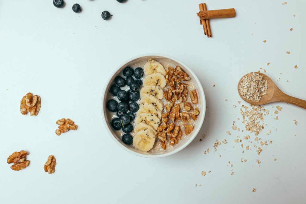 Healthy oatmeal breakfast topped with chia seeds, berries and banana