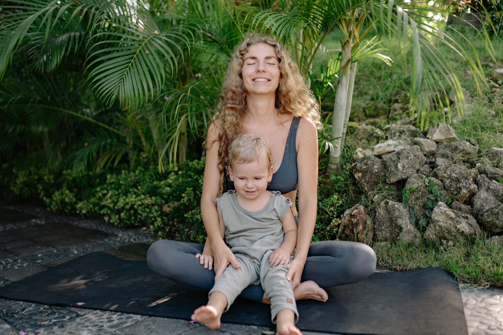 Mother and child sitting together on a mat during gentle movement