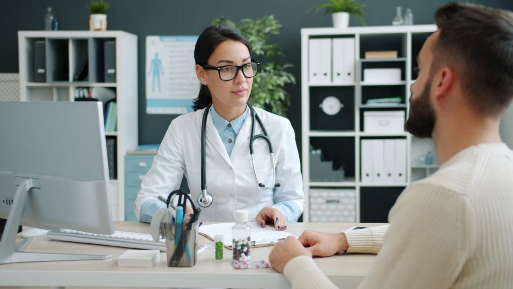 Doctor consulting with a male patient about prostate health and medical care